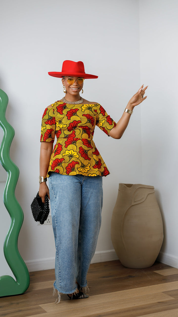 IMARA AFRICAN PRINT ASYMMETRIC PEPLUM TOP [ORANGE]