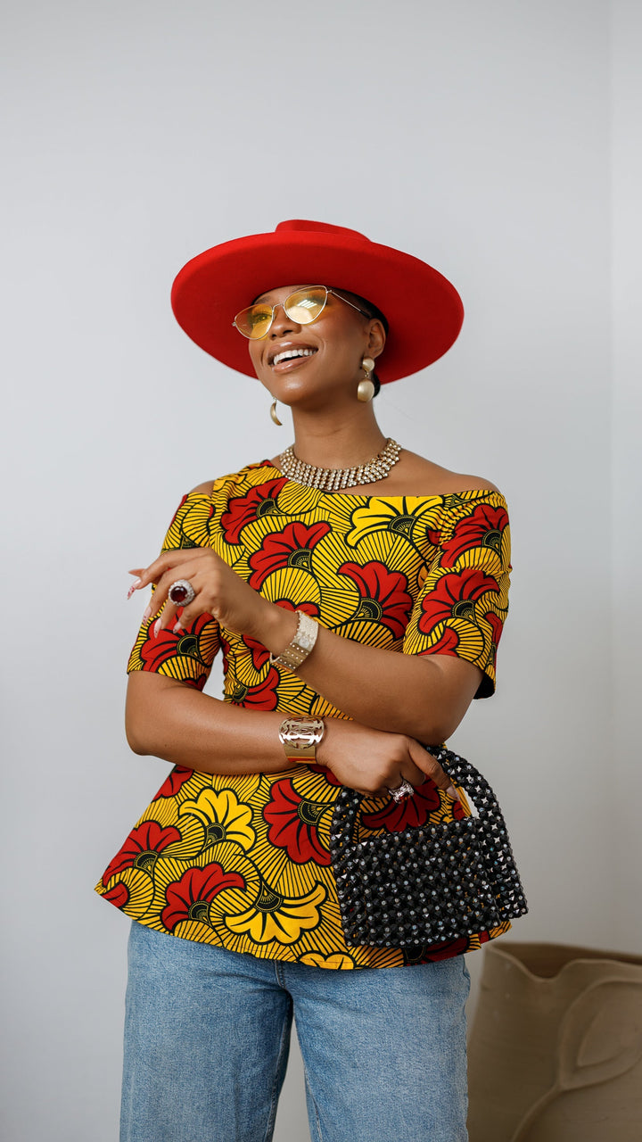 IMARA AFRICAN PRINT ASYMMETRIC PEPLUM TOP [ORANGE]