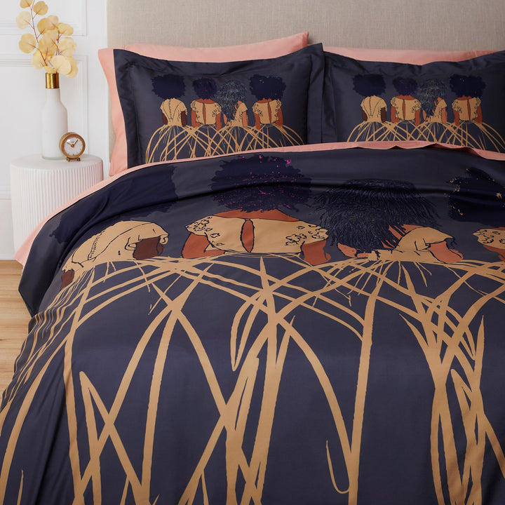 Royal Duvet Cover & Pillow Sham Set by Pardon My Fro on bed – 4 Black women in gold Art Deco gowns on charcoal navy | Especially Yours