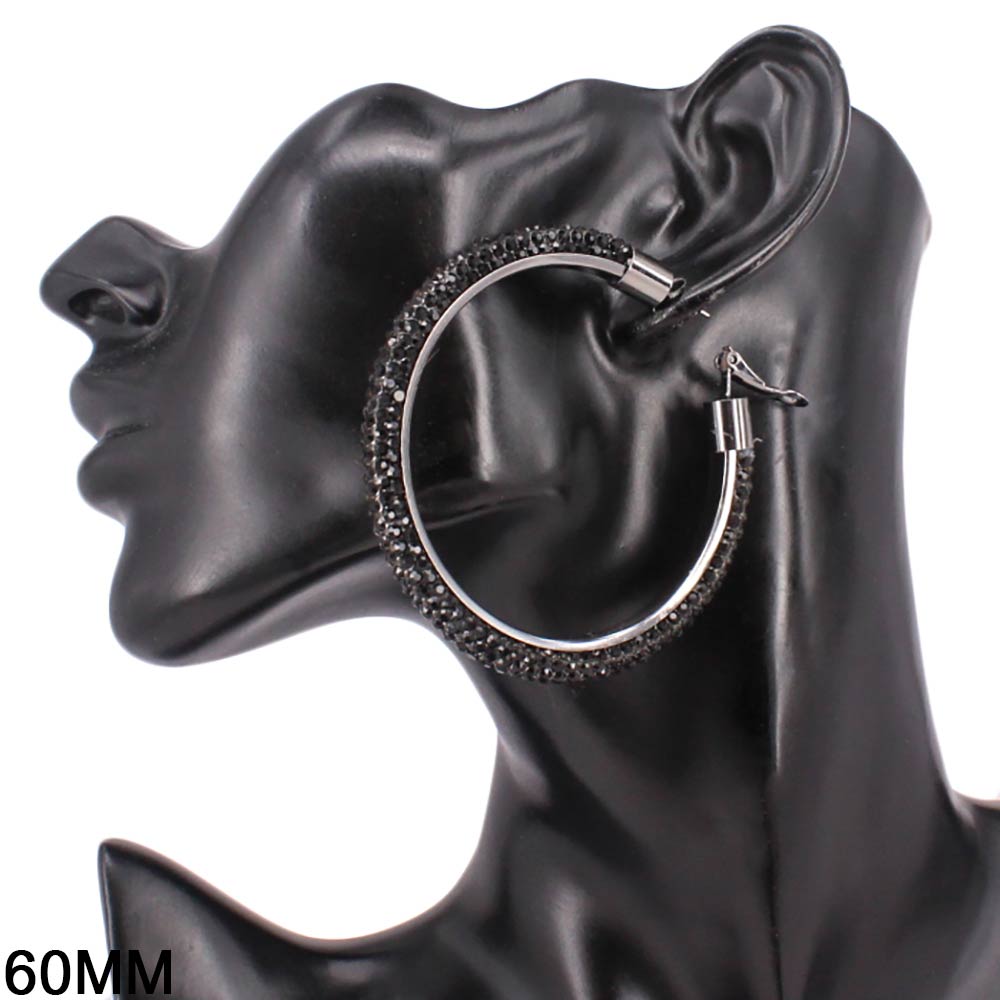 Elegant church suits for ladies accessory featuring oversized studded hoops.