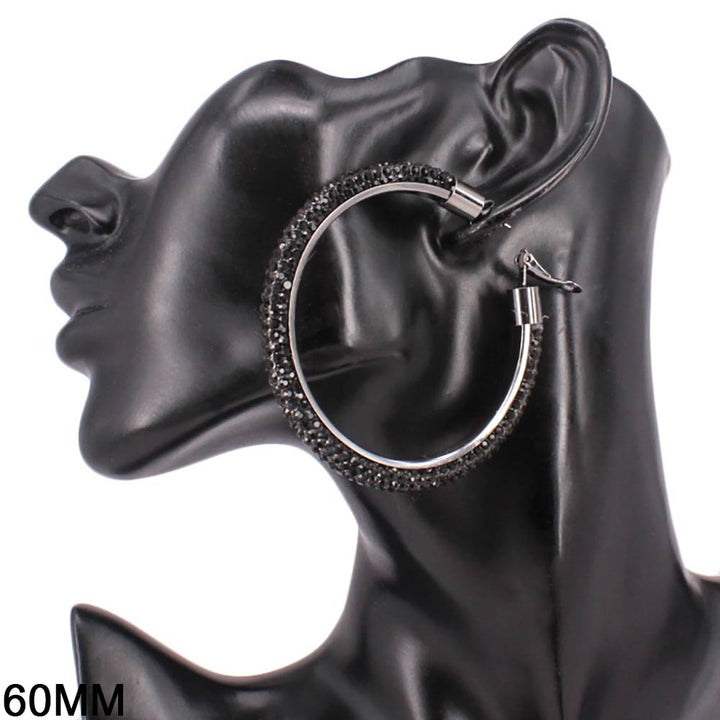 Elegant church suits for ladies accessory featuring oversized studded hoops.