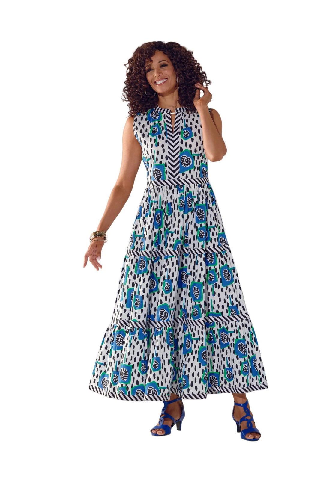 Woman wearing Paloma's Poppies tiered maxi dress in blue floral mixed print by Studio EY