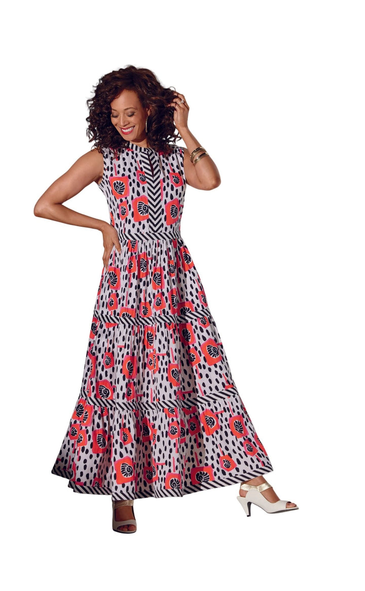 Woman wearing Paloma's Poppies tiered maxi dress in coral poppy mixed print by Studio EY