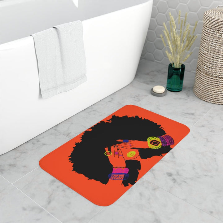 Pardon My Fro Shanell Orange Bath Mat on marble bathroom floor – Black woman natural afro with colourful bangles on red-orange | Especially Yours